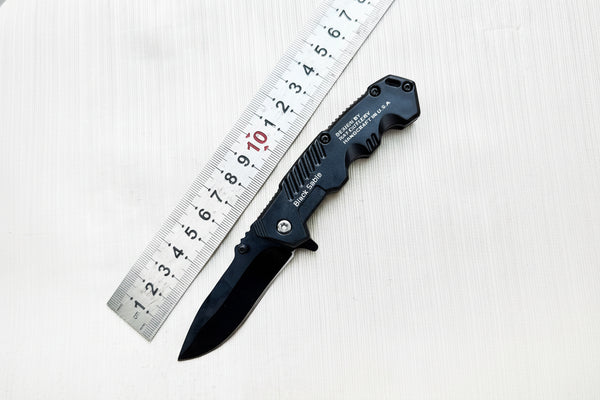 Black folding knife with measurement details on a white background