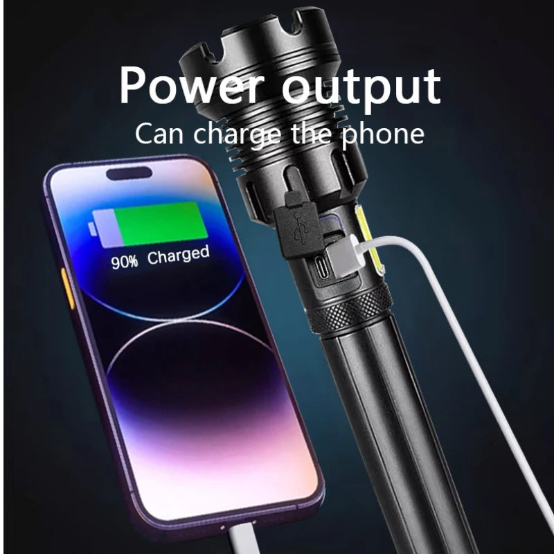Black flashlight charging a smartphone with a visible battery charge indicator on a dark background.