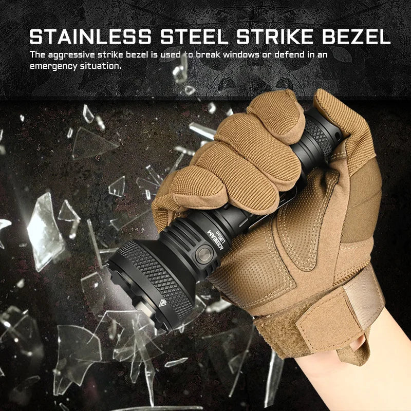 Tactical flashlight with a stainless steel strike bezel held by a gloved hand against a shattered glass background.