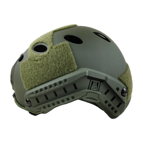 Green tactical helmet with a patch on a white background