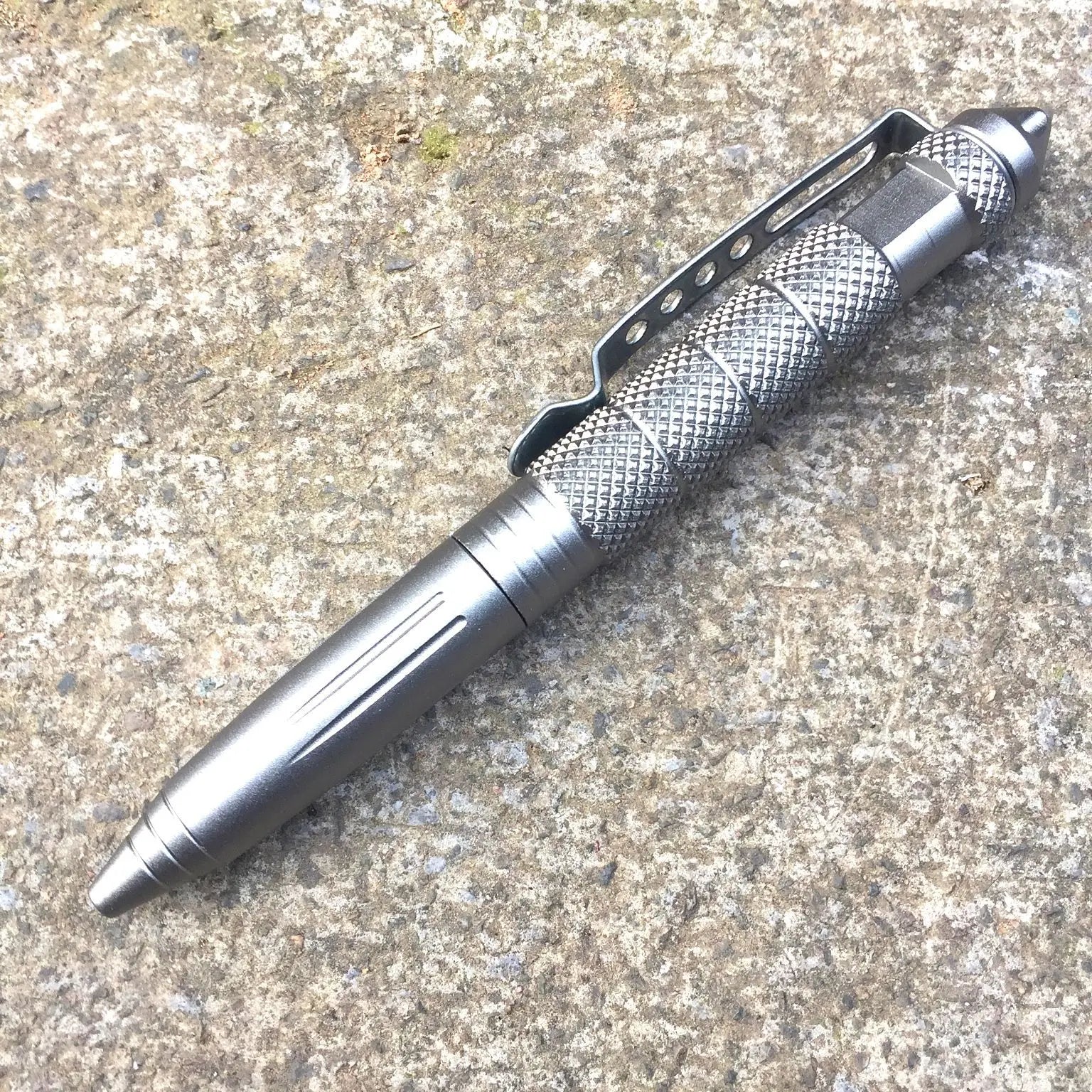 Tactical pen on a textured surface